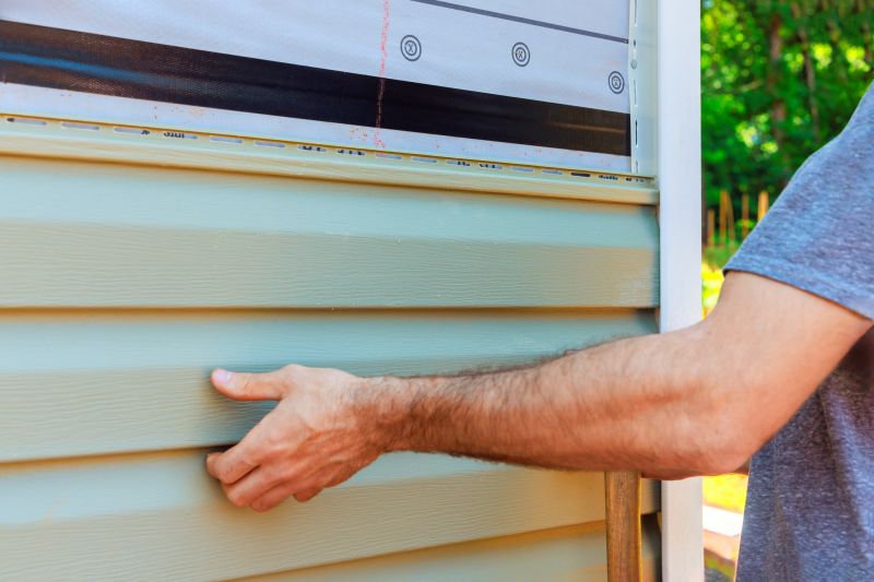 Vinyl Siding Being Installed on a Home